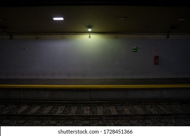 Empty train platform. Dark front view. Underground subway station without passengers. Aimlessly and lost in the way concept. - Powered by Shutterstock