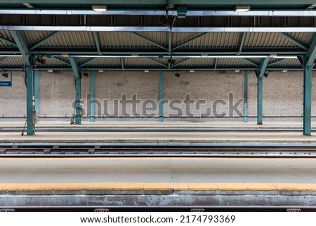 Empty train platforms at a large urban commuter train station in downtown Chicago