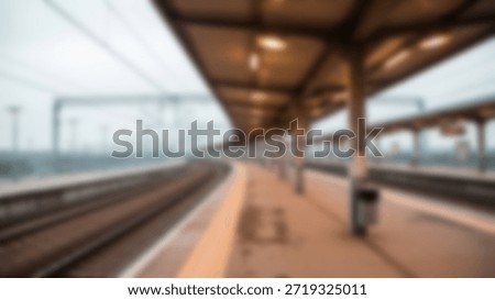 Empty Train Station Platform in Soft Focus with Moody Urban Journey Vibe.