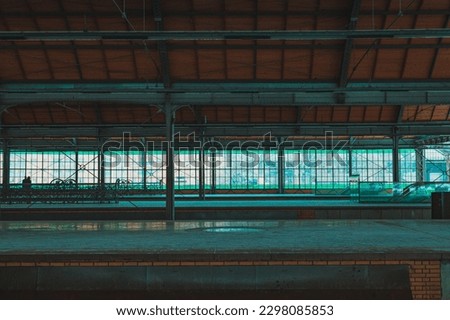 empty train station platforms under the roof