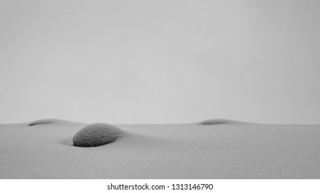 Empty and tranquil snow covered rocks 