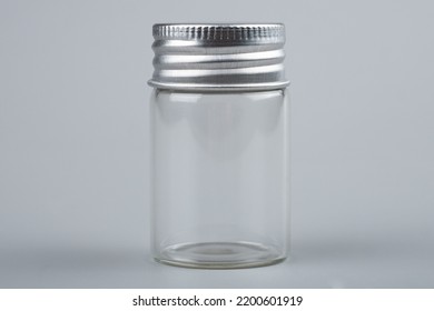 Empty Transparent Bottle Test Tube On Gray Background.