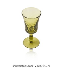 Empty transparent olive green crystal glass, Vintage glass, cordial glass, tableware, glassware, glass of water on a white background. isolated objec.