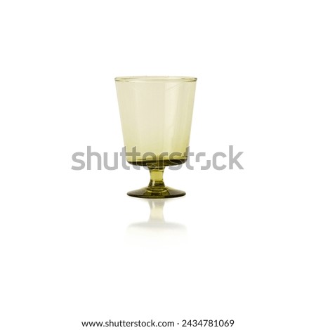 Empty transparent olive green crystal glass, Vintage glass, cordial glass, tableware, glassware, glass of water on a white background. isolated objec.