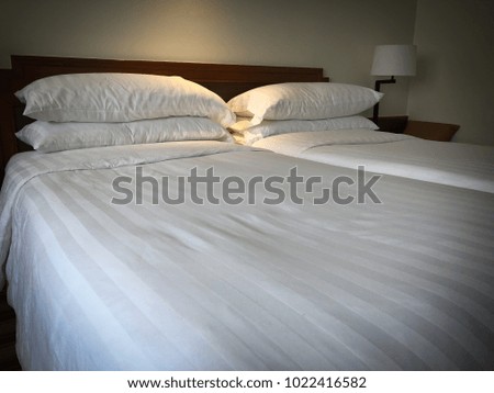 Empty twin bed in bedroom hotel