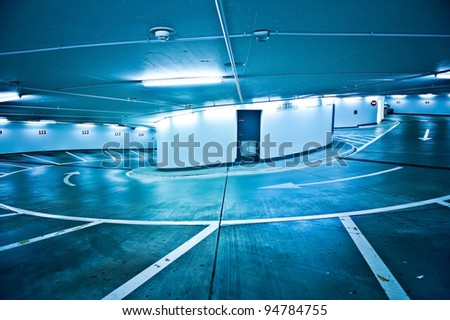 Similar – Empty multi-storey car park with yellow columns