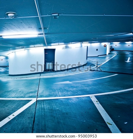 Similar – Empty multi-storey car park with yellow columns