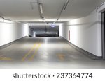 Empty underground parking lot area with lights