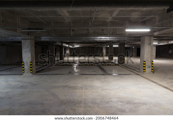 Empty underground\
parking. Free parking spaces. Alternative parking. Parking for cars\
within the city