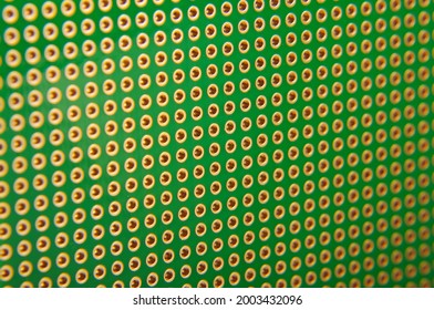 Empty universal printed circuit board PCB with drilled holed for elctronics component and prototyping