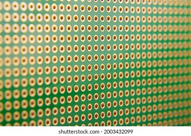 Empty universal printed circuit board PCB with drilled holed for elctronics component and prototyping