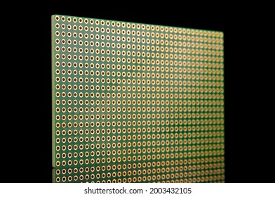 Empty universal printed circuit board PCB with drilled holed for elctronics component and prototyping