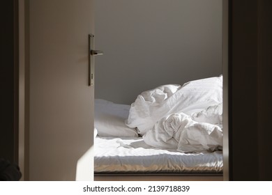 Empty Unmade Bed In The Morning	