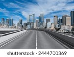 Empty urban asphalt road exterior with city buildings background. New modern highway concrete construction. Concept way to success. Transportation logistic industry fast delivery. Seattle. USA.