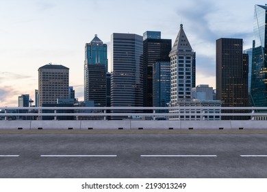 Empty Urban Asphalt Road Exterior With City Buildings Background. New Modern Highway Concrete Construction. Concept Way To Success. Transportation Logistic Industry Fast Delivery. Seattle. USA.