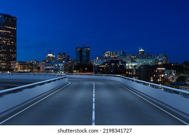 Empty Urban Asphalt Road Exterior With City Buildings Background. New Modern Highway Concrete Construction. Concept Way To Success. Transportation Logistic Industry Fast Delivery. Seattle. USA.