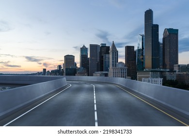 Empty Urban Asphalt Road Exterior With City Buildings Background. New Modern Highway Concrete Construction. Concept Way To Success. Transportation Logistic Industry Fast Delivery. Seattle. USA.