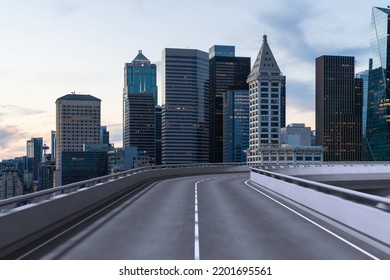 Empty Urban Asphalt Road Exterior With City Buildings Background. New Modern Highway Concrete Construction. Concept Way To Success. Transportation Logistic Industry Fast Delivery. Seattle. USA.