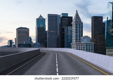 Empty Urban Asphalt Road Exterior With City Buildings Background. New Modern Highway Concrete Construction. Concept Way To Success. Transportation Logistic Industry Fast Delivery. Seattle. USA.