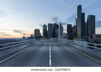 Empty Urban Asphalt Road Exterior With City Buildings Background. New Modern Highway Concrete Construction. Concept Way To Success. Transportation Logistic Industry Fast Delivery. Seattle. USA.