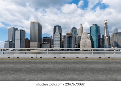 Empty urban asphalt road exterior with city buildings background. New modern highway concrete construction. Concept of way to success. Transportation logistic industry fast delivery. New York. USA. - Shutterstock ID 2347670089