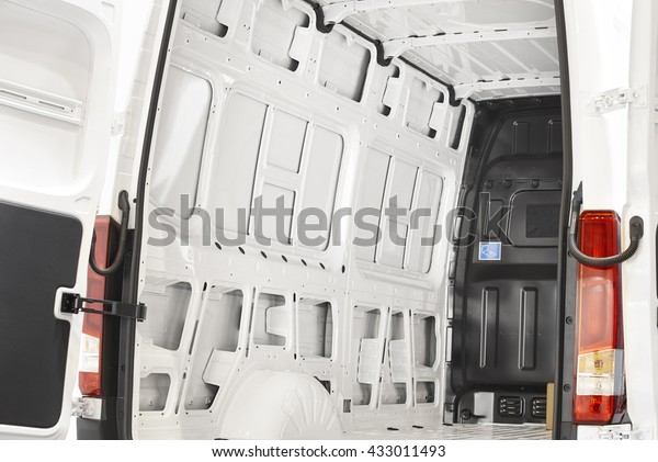 Empty\
van with open doors ready to be loaded.\
Horizontal