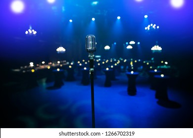 Empty Venue And A Microphone On Stage Facing The Crowd