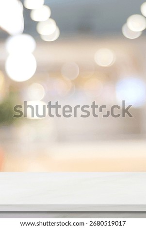 Empty vertical white table top, counter, desk background over blur  bokeh background, White marble stone table, shelf and blurred kitchen restaurant for food, product display mockup, template