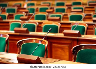 Empty vintage congress hall with seats and microphones. - Shutterstock ID 223257358