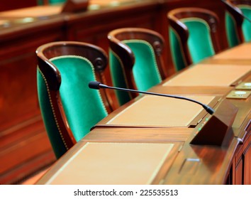 Empty vintage congress hall with seats and microphones. - Shutterstock ID 225535513