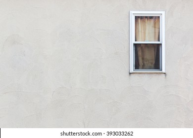Empty Wall With Small Window Detail Of House Exterior Wall.