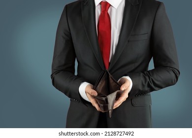 Empty Wallet In The Hands Of A Young Man. Businessman Without Money. The Concept Of Loss, Lost Savings, Failed Startup.