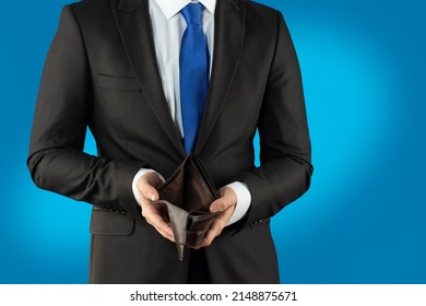 Empty Wallet In The Hands Of A Young Man. Businessman Without Money. The Concept Of Loss, Lost Savings, Failed Startup.