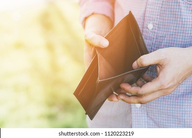 Empty Wallet (no Money) In The Hands Of An Businessman. High Cost Of Living In City Cost Control Expenses Poverty In Concept.