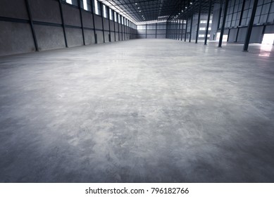 Empty warehouse structure made with strong construction of concrete, iron and metal.