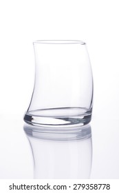 Empty water glass on white background.