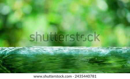Empty water table on blurred background copy space for product montage or promotional design, Empty water with abstract bokeh background