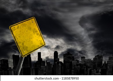 Empty weather warning sign against a powerful stormy background with city silhouette and copy space. Dirty and angled sign with cyclonic winds add to the drama.