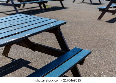 Empty Weathered Blue Wooden Picnic Table In An Empty Pub Beer Garden