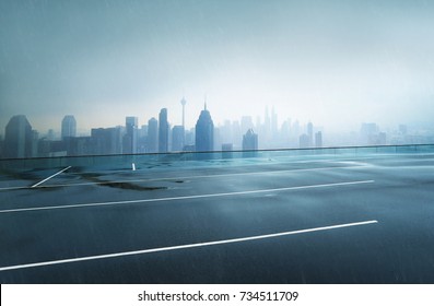 Empty wet asphalt road with foggy city skyline background , raining day . - Powered by Shutterstock