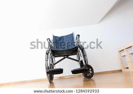 Similar – Senior woman in a wheelchair alone