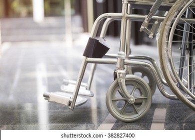 Empty Wheelchair Parked In Hospital