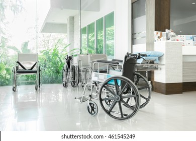 Empty Wheelchair Parked In Hospital Hallway