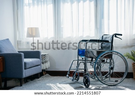 Empty wheelchair parked in nursing home. for senior or disabled assistance in living room at home.
