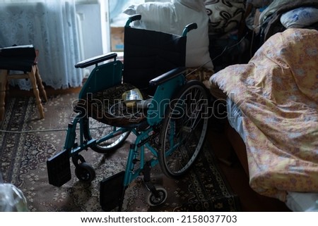 Similar – Caregiver making bed of elderly patient in nursing home