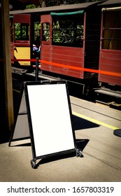 An Empty White Advertising Signboard, Billboard, Banner Attached With Wheels Placing At The Train Station Platform In Melbourne, Australia