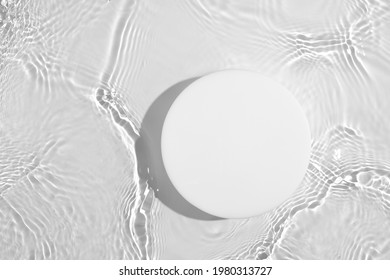 Empty white circle podium on transparent clear calm water texture with splashes and waves in sunlight. Abstract nature background for product presentation. Flat lay cosmetic mockup, copy space. - Shutterstock ID 1980313727