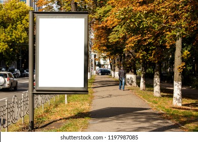 Empty White Citylight Near The Pedestrian Road. Blank Vertical Billboard On The Street During Autumn, Blank Template
