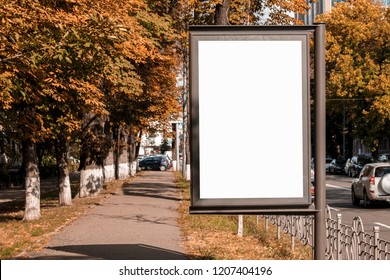 Empty White Citylight Near The Pedestrian Road. Blank Vertical Billboard On The Street During Autumn, Blank Template
