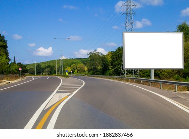 Empty White Horizontal Billboard On The Roadside. Empty Asphalt Road, Blank Outdoor Billboar Mock Up.